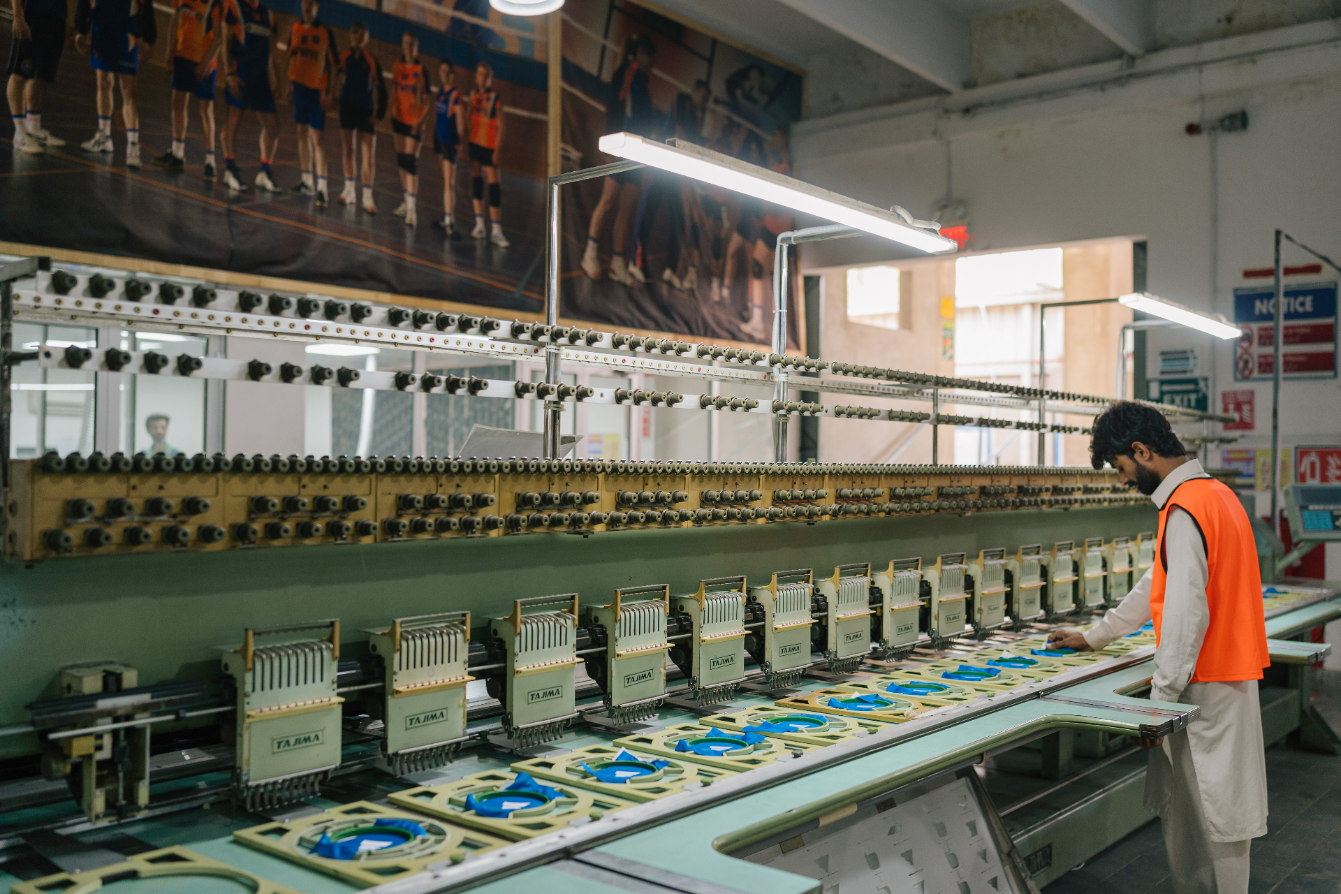 Multi-head Tajima embroidery machine stitching team logos